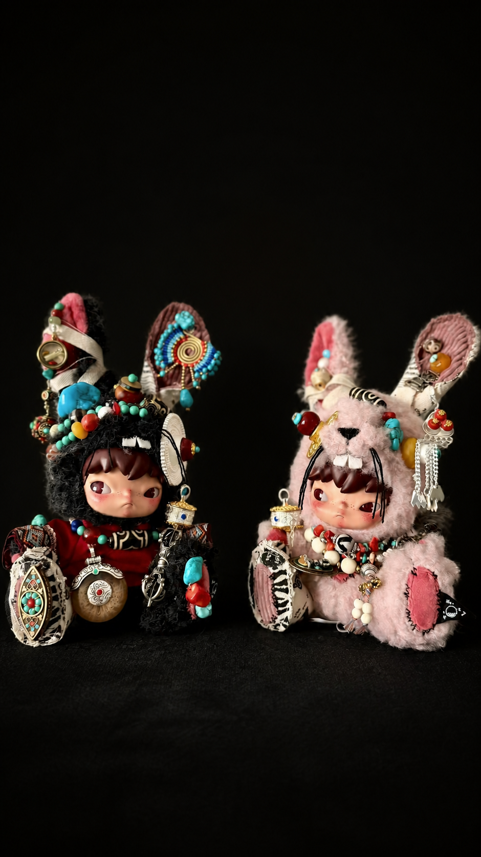 Two separately styled collectible figures shown together in the obsidian studio