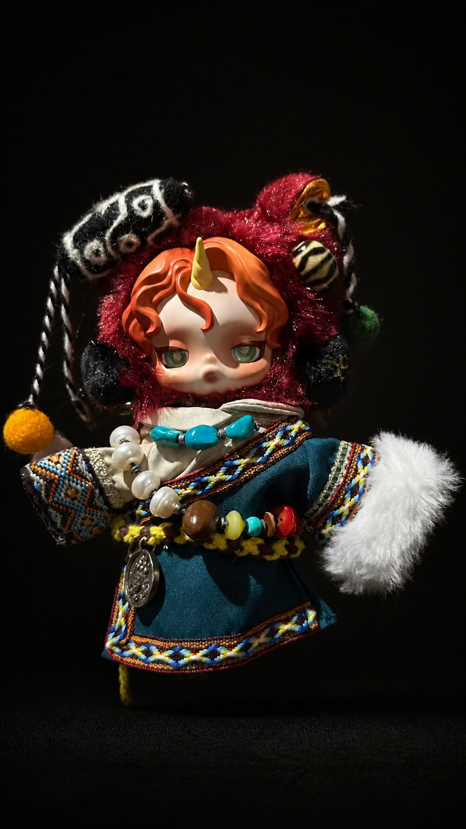 Crimson-haired collectible figure styling in the obsidian studio